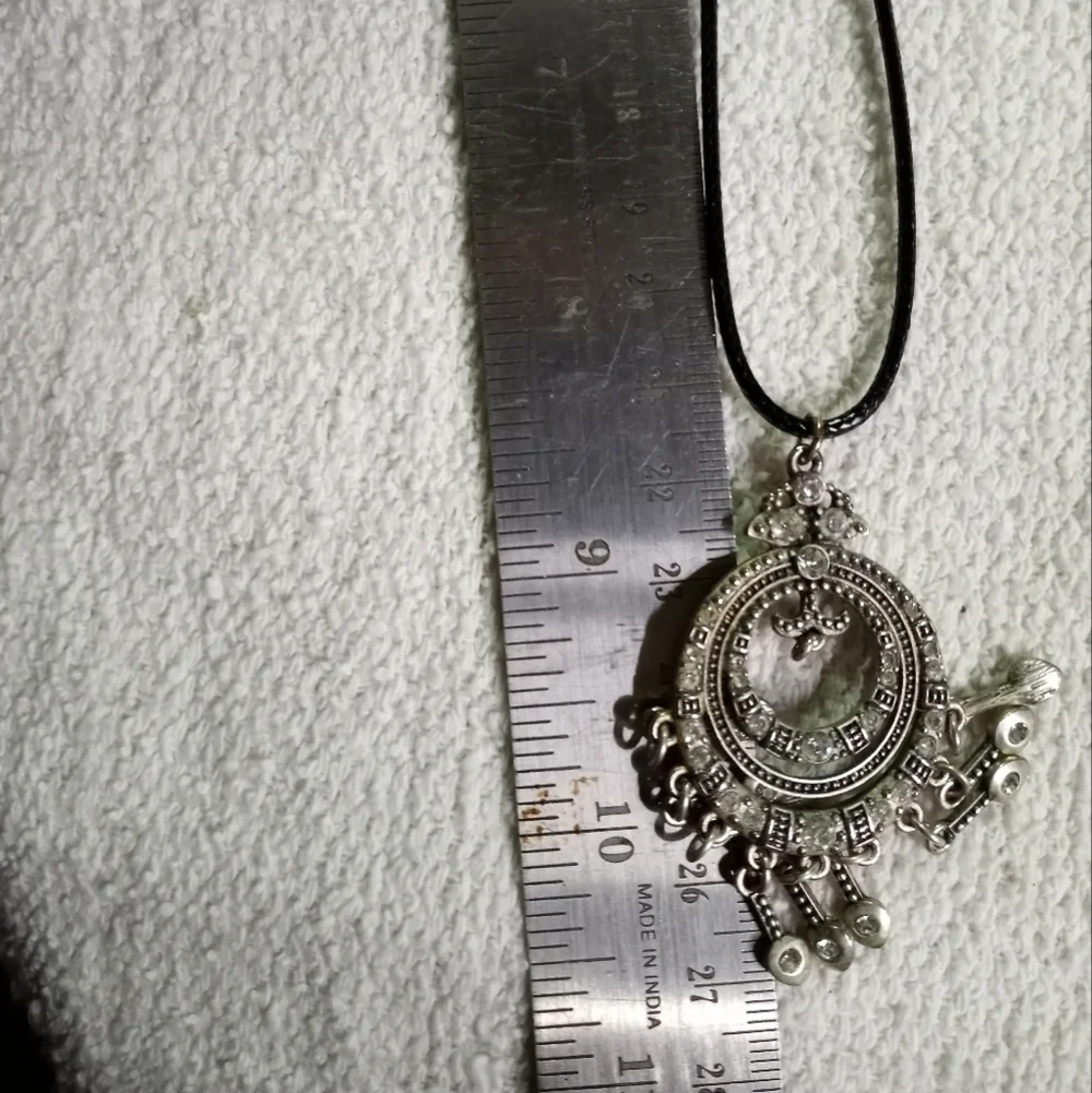 Silvertone crystal Premier designs pendant on black cord